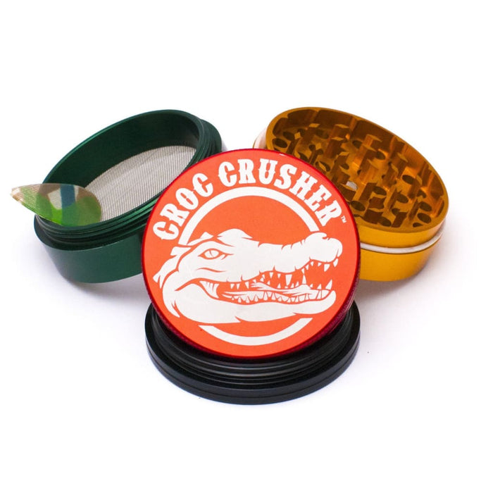 Croc Crusher Grinder With Diamond Teeth And Teflon Glide Ring, Featuring a Crocodile Logo