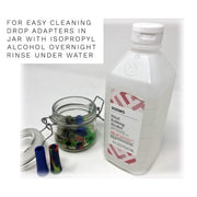 Bottle of Solimo ethyl rubbing alcohol next to jar of colorful filter weed pipe adapters